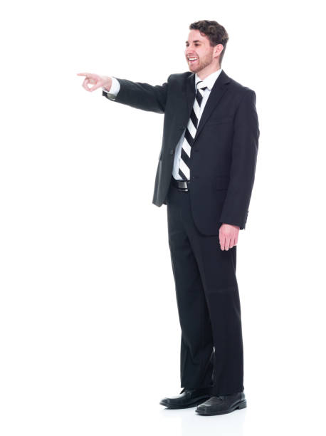 istock Young handsome businessman wearing a suit and tie - pointing 1146087147