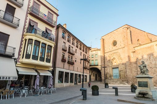 Cardona, Spain - October 31, 2016: Church of Sant Miquel of Cardona with people around in the center of the medieval city of Cardona in Catalonia, Spain