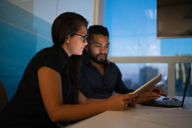 istock Coworkers checking information in digital tablet 1146093226