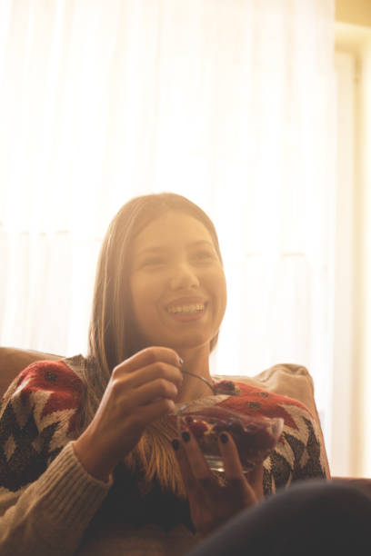 istock Young woman eating muslie . 1146095340