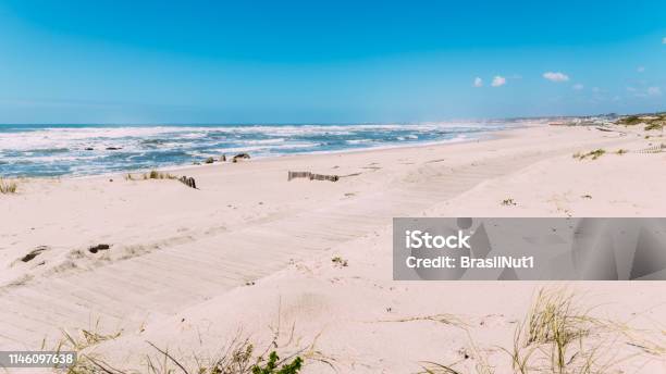 Wooden Boardwalk At The Praia Da Frente Azul In English The Blue Beach Front In The Seaside Resort Espinho Stock Photo - Download Image Now