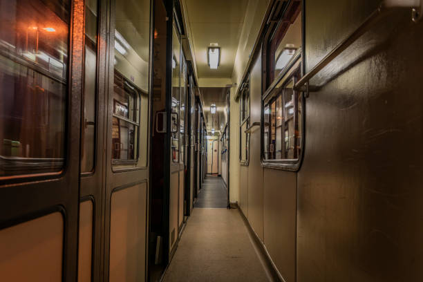 istock Dark night corridor with doors to compartments in czech train 1146099837