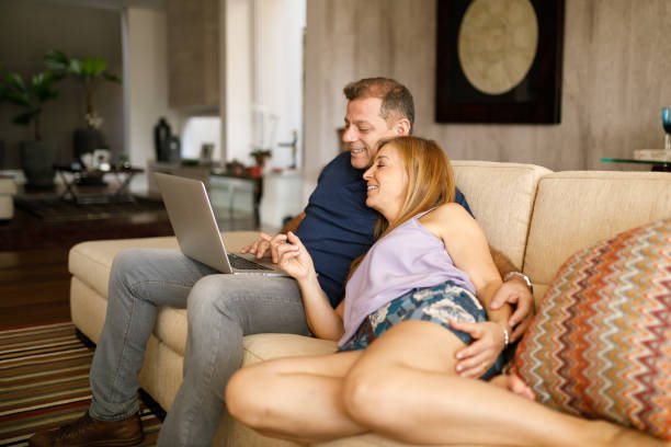 istock Couple planning next trip on couch 1146103882