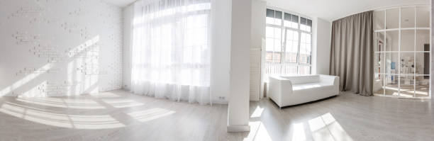 istock Blank white wall with window and concrete floor, mock up, 3d render 1146104371