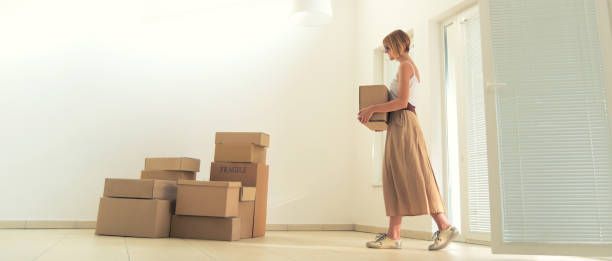 istock Young woman moving into the house 1146105246