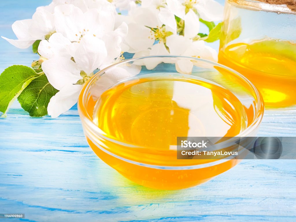 fresh honey, blooming apple tree, wooden background Autumn Stock Photo