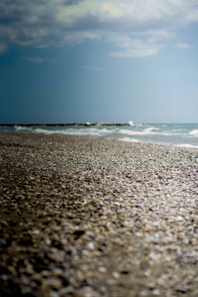 istock sunny day at the beach. waves, wind and a good depth of field. 1146106830