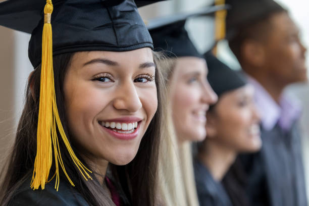 closeup portrait of teen girl during graduation ceremony - grad portrait imagens e fotografias de stock