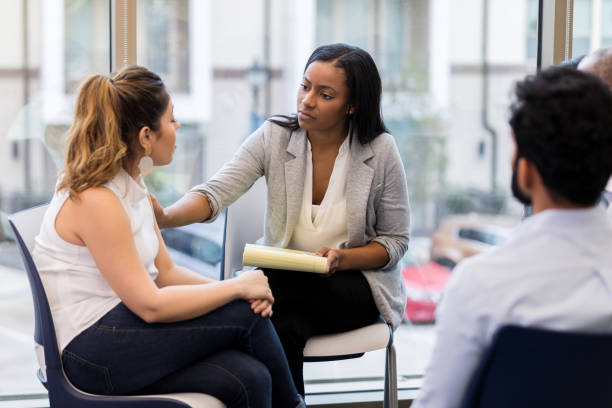 istock A mid adult woman shares her experience 1146107185