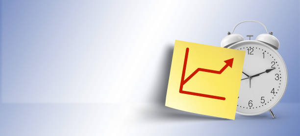 istock as a reminder, growth symbol on yellow sticky note paper with white alarm clock 1146107864