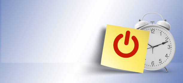 istock as a reminder, on off  symbol on yellow sticky note paper with white alarm clock 1146107987