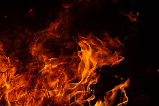 istock On fire. Themes of fire, disaster and extreme events. Background with copy space 1146108252