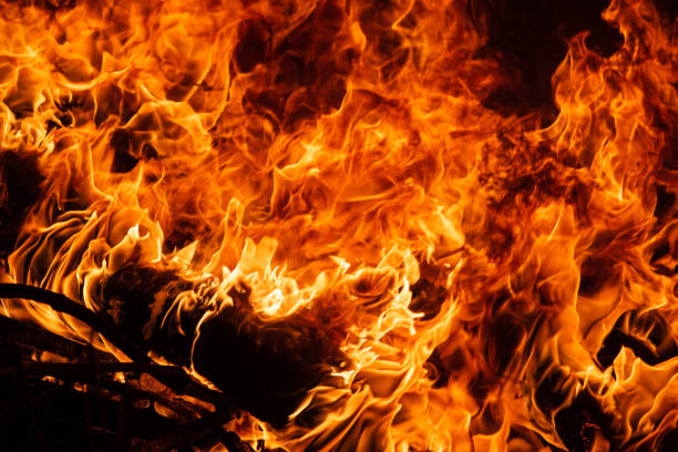 istock On fire. Themes of fire, disaster and extreme events. Background with copy space 1146108267