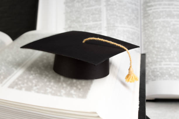 istock Open book on wooden deck table and black board background. Back to School. Education concept with copy space for your ad text. 1146109213