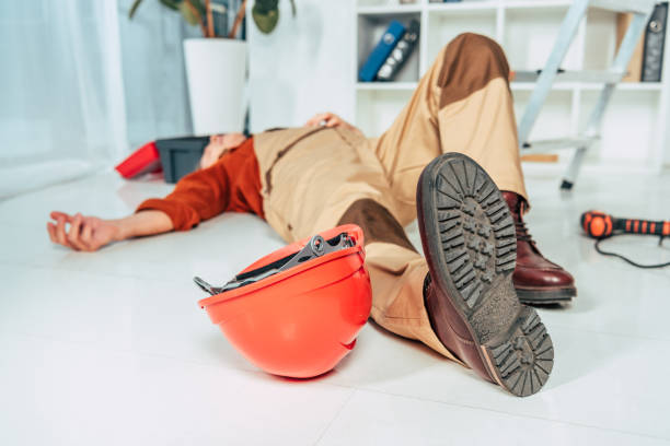istock repairman lying on white floor in uniform in office 1146110869