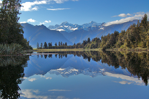 New Zealand / Aotearoa, west coast, impressive reflection of Mount Cook / Aoraki and Mount Tasman at the famous mirror lake Lake Matheson