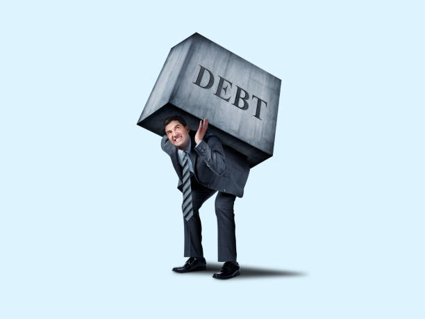 istock Businessman Burdened By Debt 1146116705