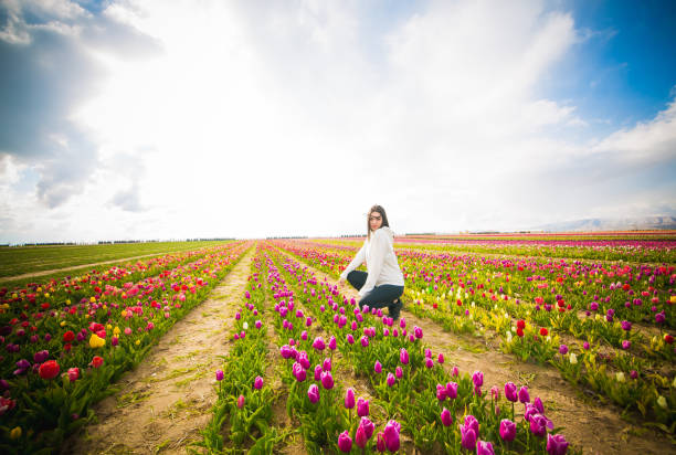 istock young model in a field of tulips 1146116735