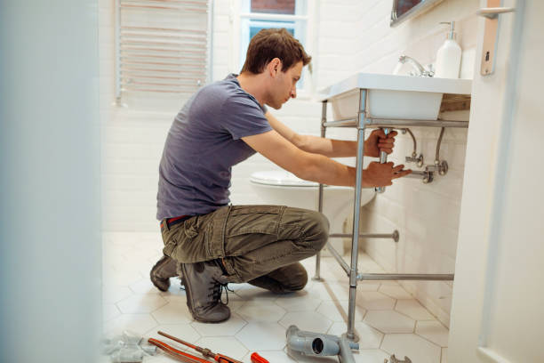 istock Young man fixing a leak under the bathroom sink 1146119967
