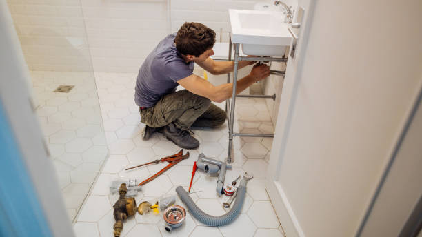 istock Young man fixing a leak under the bathroom sink 1146119976