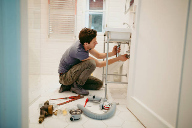istock Young man fixing a leak under the bathroom sink 1146119992