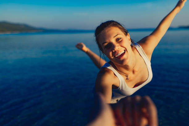 istock Young woman enjoying on beach at dusk 1146123342