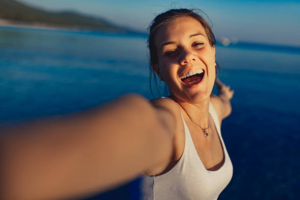 istock Young woman enjoying on beach at dusk 1146123354