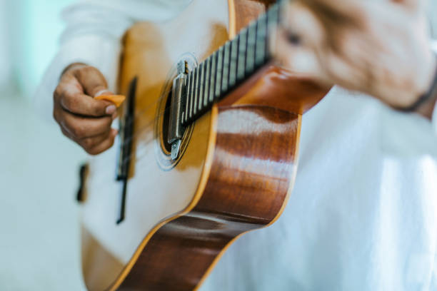 In Old Havana, close-up of a Cuban musician hands while he is playing the guitar. stock photo