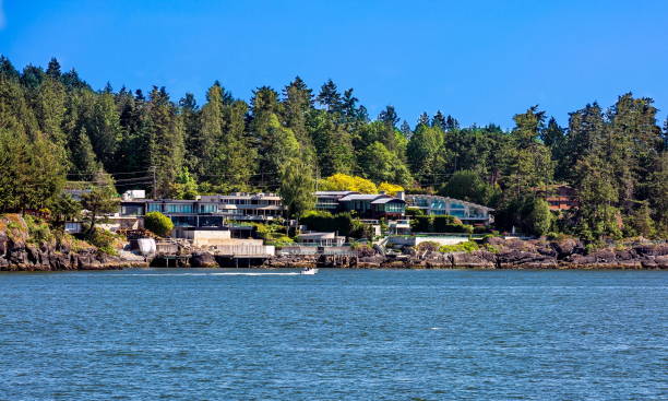 The village on a forested  slope The village is on the shore of the bay on the wooded slope of the suburb of West Vancouver.  Horseshoe Bay   West Vancouver British Columbia, Canada west vancouver stock pictures, royalty-free photos & images
