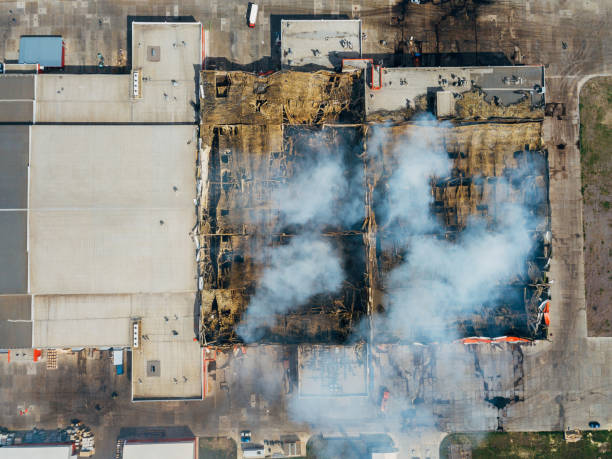 istock Burning industrial distribution warehouse, top view from drone 1146131366