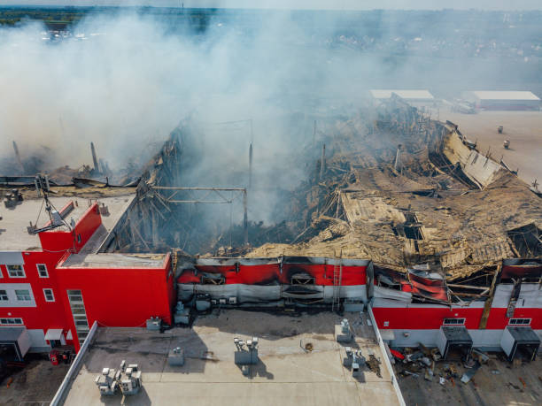 istock Aerial view of burning industrial distribution warehouse 1146131368