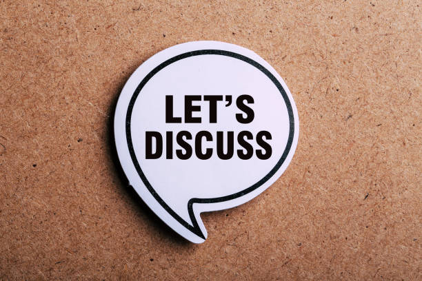 istock Let Us Discuss Speech Bubble Isolated On Brown paper Background 1146135445