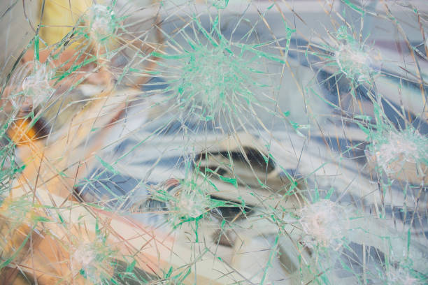 istock photo broken window looks like bullet hole 1146136613