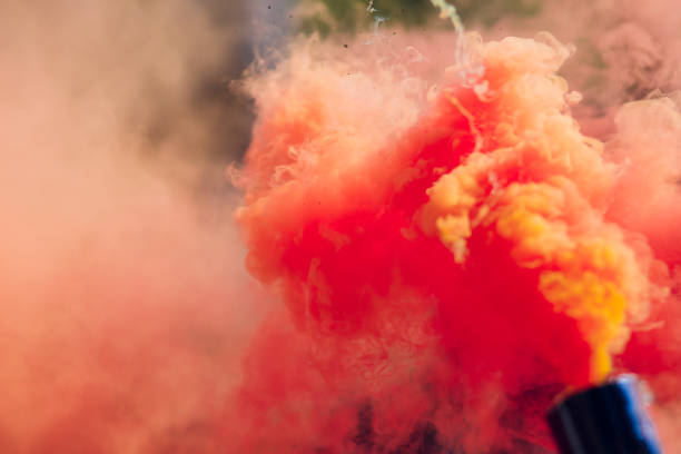 istock colorful red smoke bombs in action 1146137732