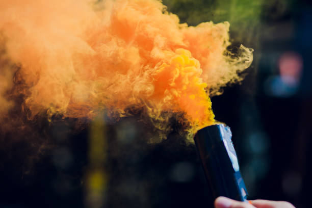 istock colorful orenge smoke bombs in action 1146137745