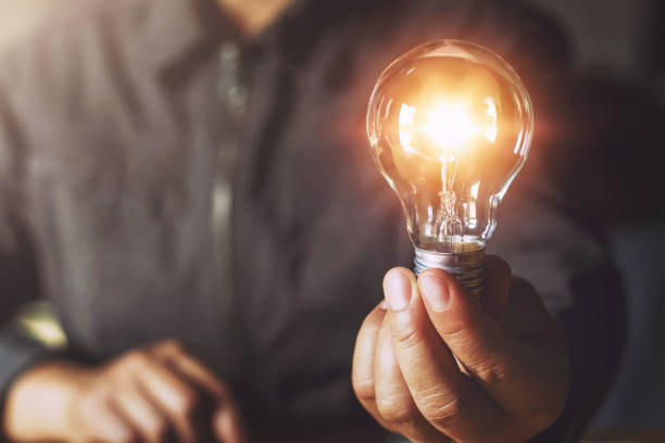 istock hand holding light bulb. idea concept with innovation and inspiration 1146140246
