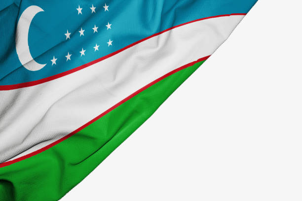 istock Uzbekistan flag of fabric with copyspace for your text on white background 1146140568