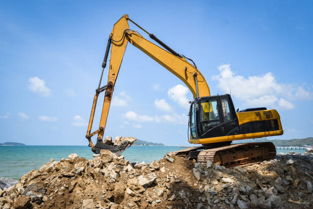 istock backhoe loader digger excavator stone working construction site on the beach sea ocean 1146141316
