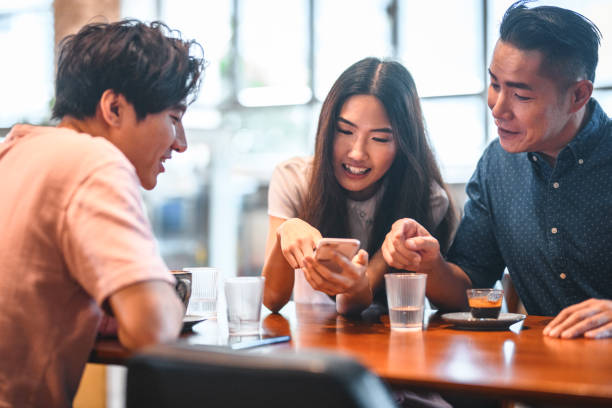 istock Friends talking at table in a cafe 1146143279
