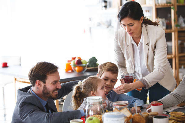 istock Parents giving breakfast to their kids before going to work 1146143376