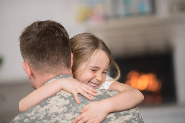 istock Military Dad Hugging His Young Daughter 1146144661