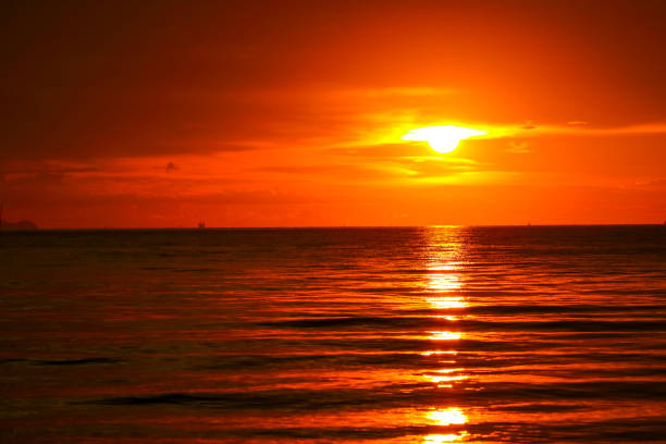 istock sunset on sea and ocean last light red sky silhouette cloud 1146147429