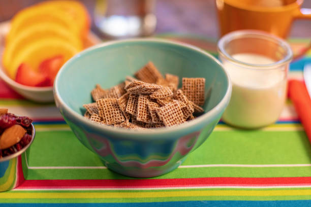Breakfast Cereal Colorful Place Setting Including Fruit, Nuts and Beverages