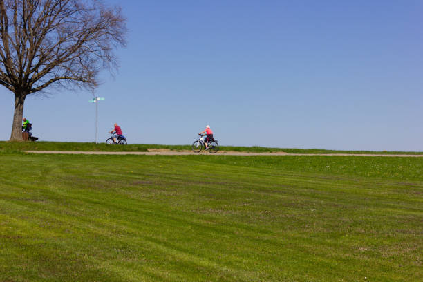 istock cyclist on the horizon with blue sky 1146150385