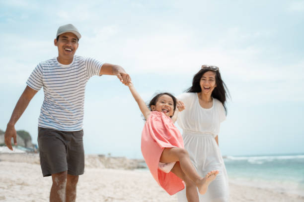 istock playing swinging together hold hand father and mother 1146154133