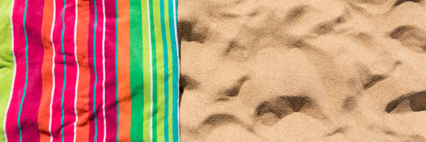 istock Beach towel on sandy tropical beach 1146159513