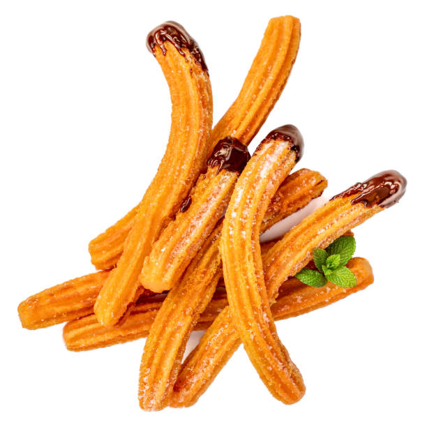 istock Churros stacked with chocolate sauce dip  isolated on white background. Churro - traditional Mexican  dessert. Fried pastry