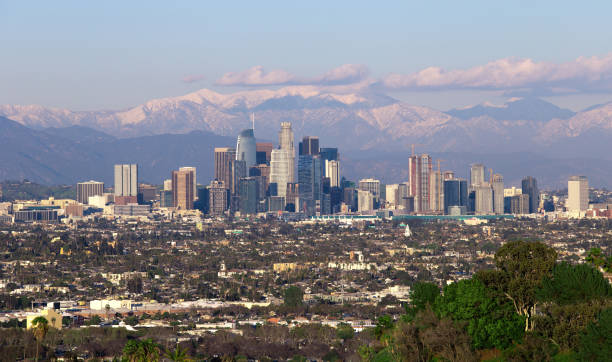 istock Los Angeles City Scape With Snowy Mountains 1146162084