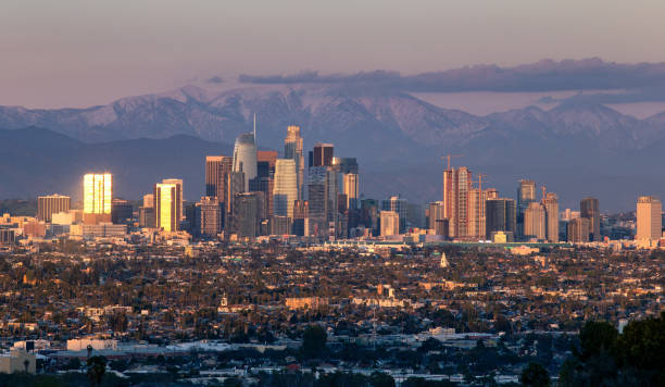 istock Los Angeles City Scape With Snowy Mountains 1146162088