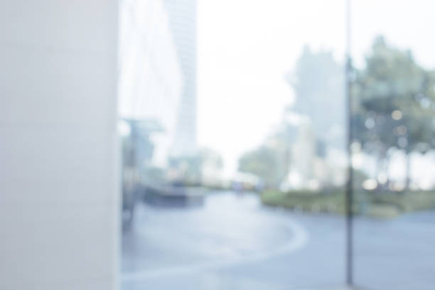 istock Blurred abstract glass wall from building in city town 1146162793